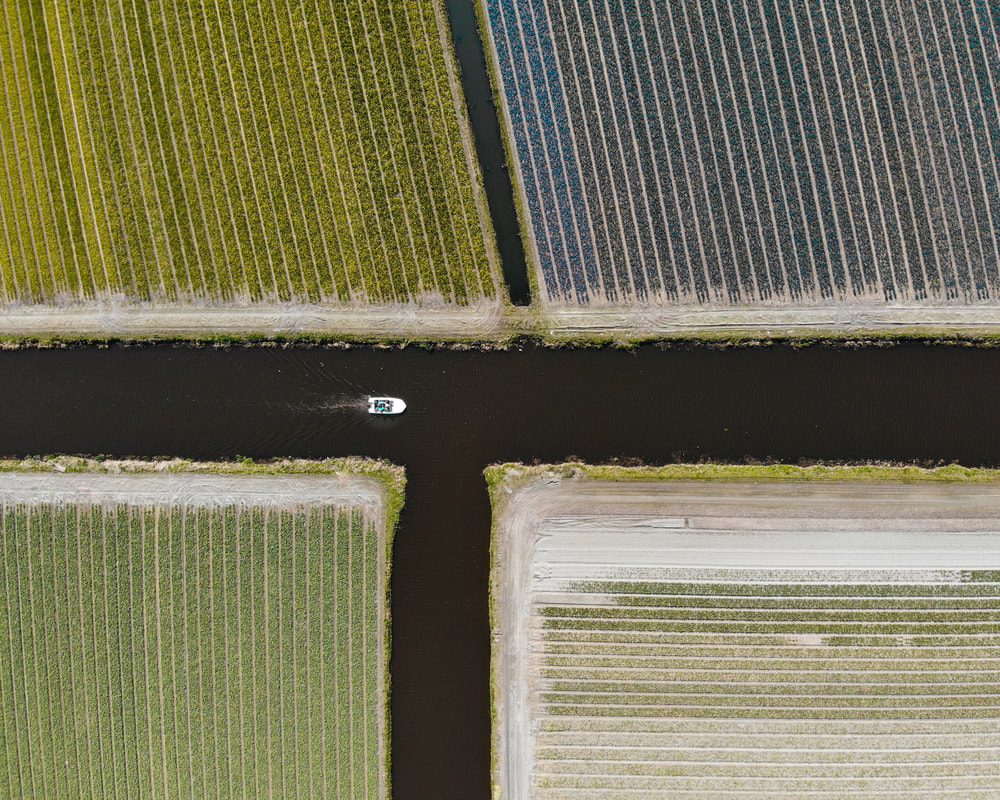 Aerial photo of a boat on the Holland waterways - boot op de nederlandse wateren  - Traveltower